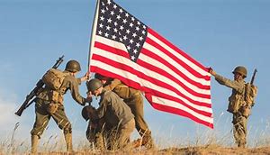Soldiers planting American Flag